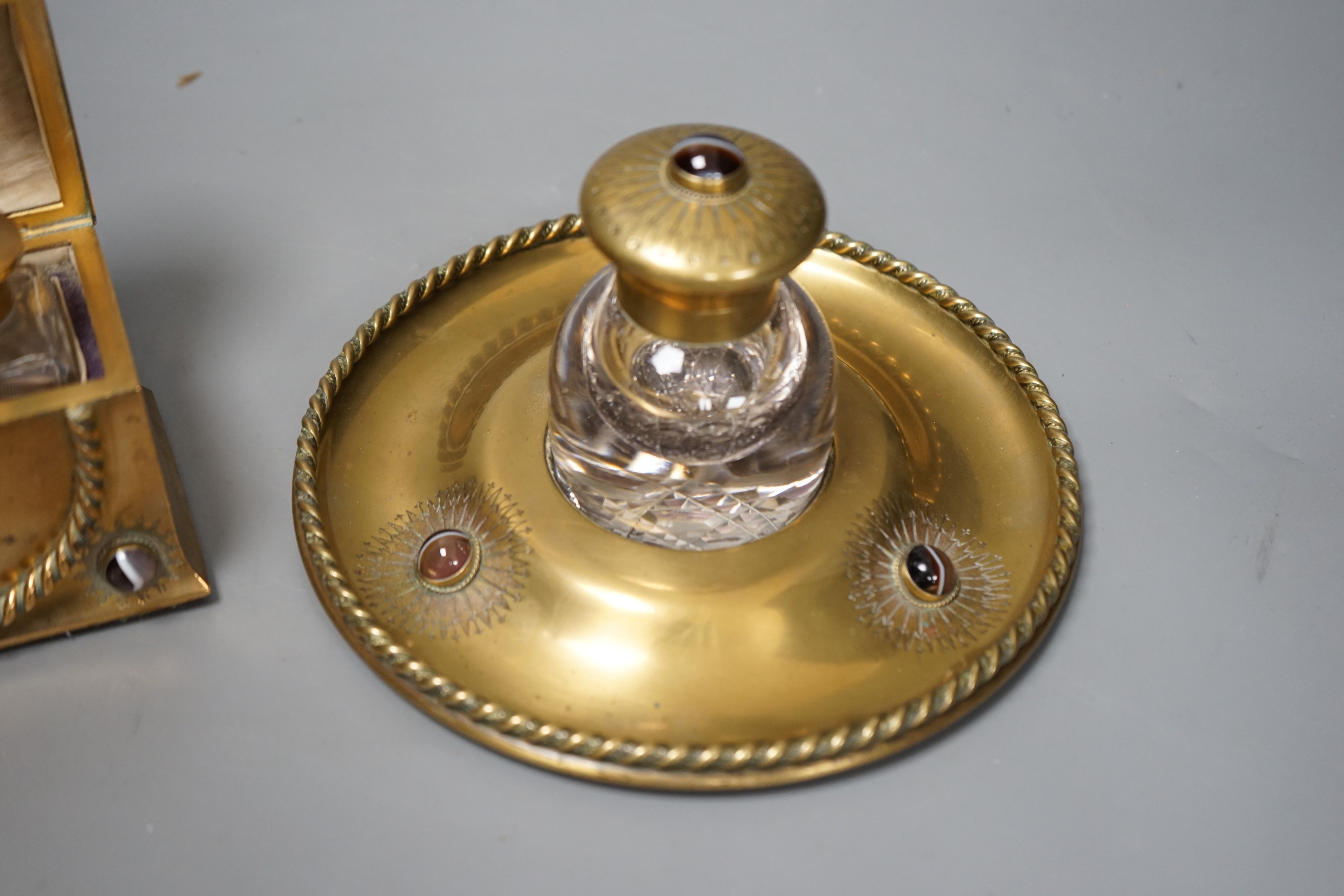 A Victorian agate mounted brass scent bottle casket and similar circular chest inkstand with knotted ribbon relief, 12cm wide